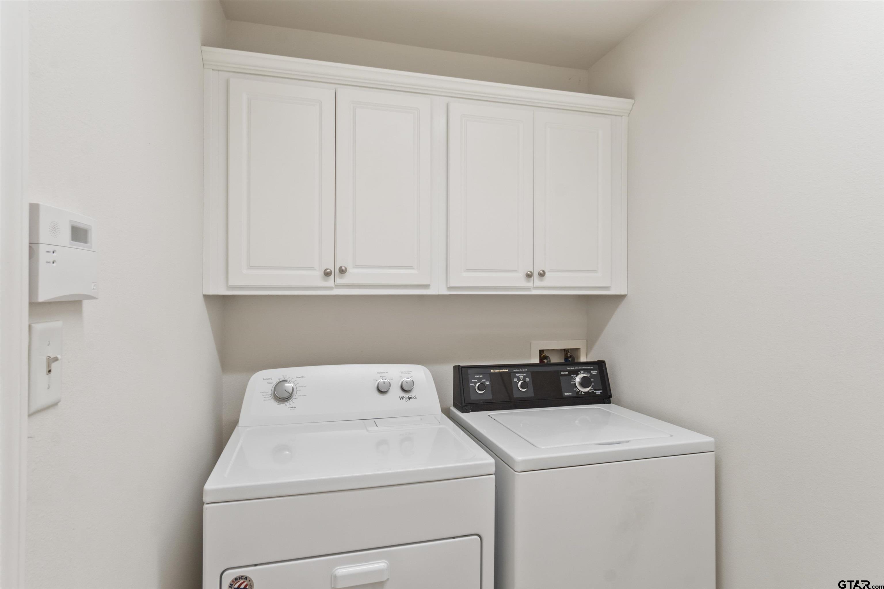 1521 Rice Road, Unit G102 Tyler, TX 75703 - Photo 12 of 23 a utility room with dryer and washer