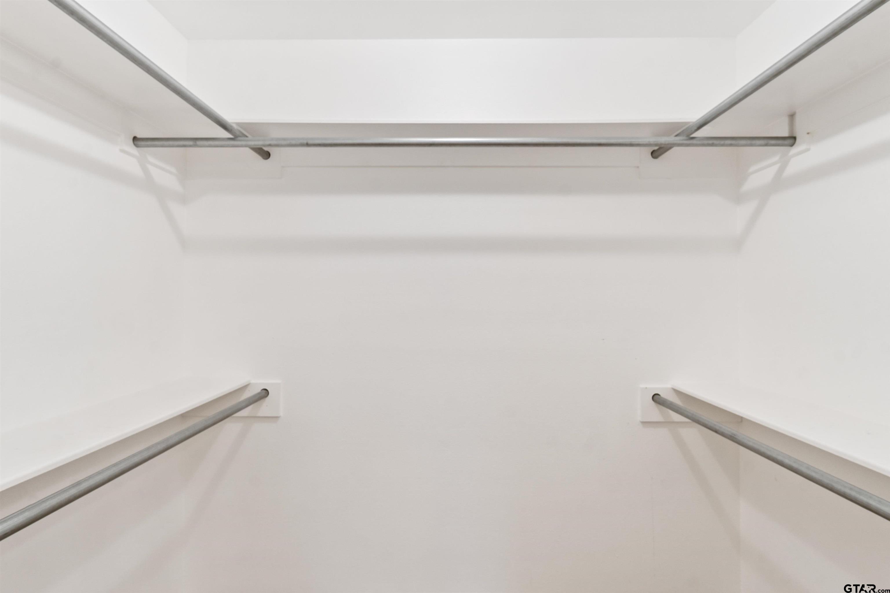 1521 Rice Road, Unit G102 Tyler, TX 75703 - Photo 16 of 23 a view of a room with racks on the wall