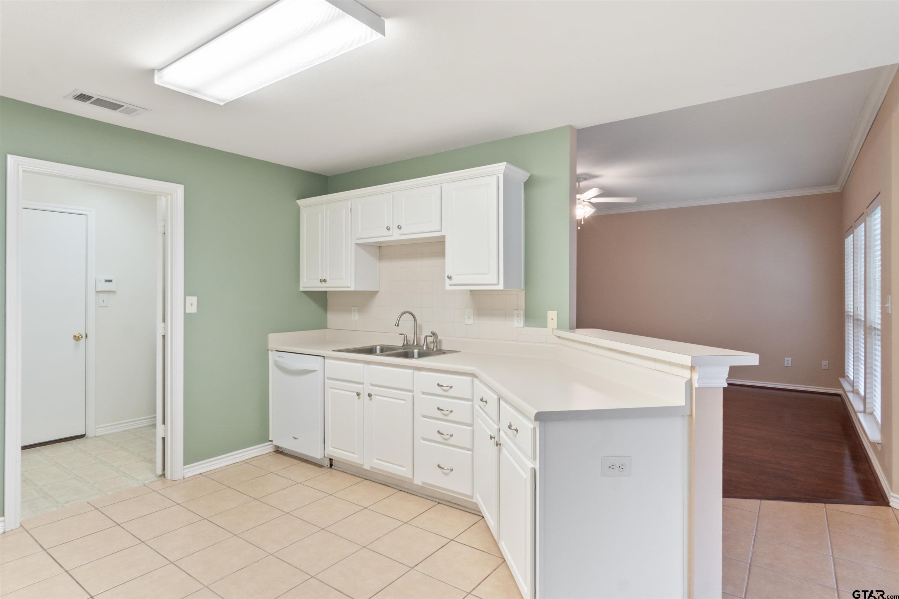 1521 Rice Road, Unit G102 Tyler, TX 75703 - Photo 8 of 23 a spacious bathroom with a sink a mirror and a vanity