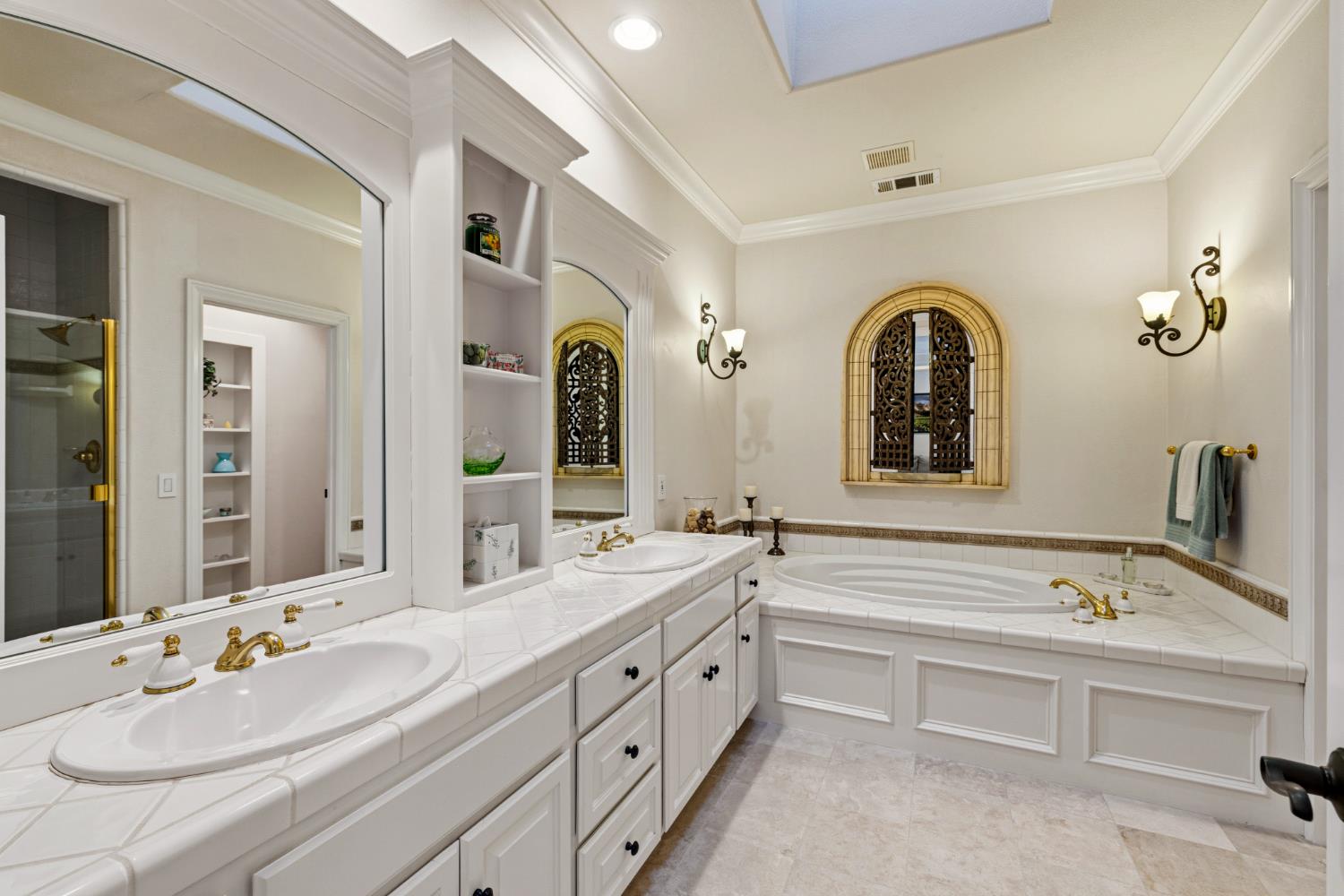5869 Granite Hills Drive South Granite Bay, CA 95746 - Photo 41 of 66 a spacious bathroom with a double vanity sink and a mirror