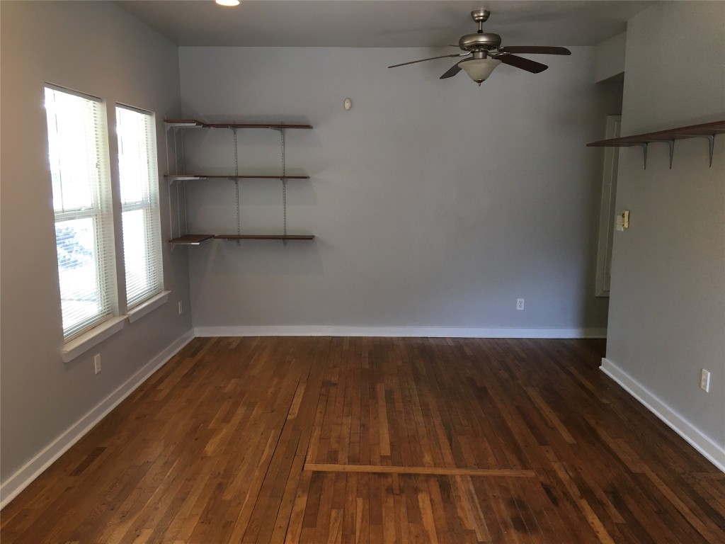 4802 Clarkson Avenue Austin, TX 78751 - Photo 22 of 38 wooden floor in an empty room with a window