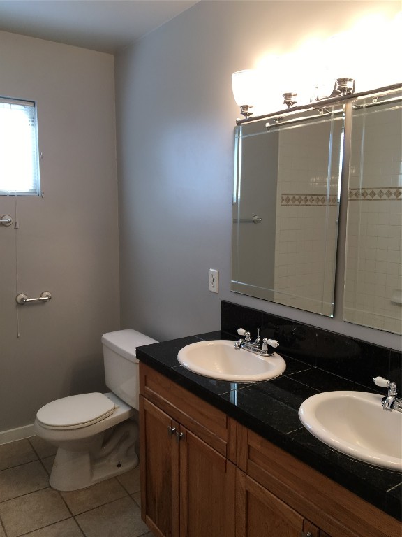 4802 Clarkson Avenue Austin, TX 78751 - Photo 34 of 38 a bathroom with a sink a toilet and mirror