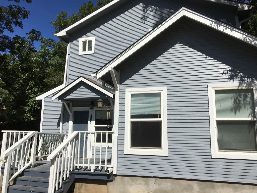 4802 Clarkson Avenue Austin, TX 78751 - Photo 7 of 38 a front view of a house with a porch