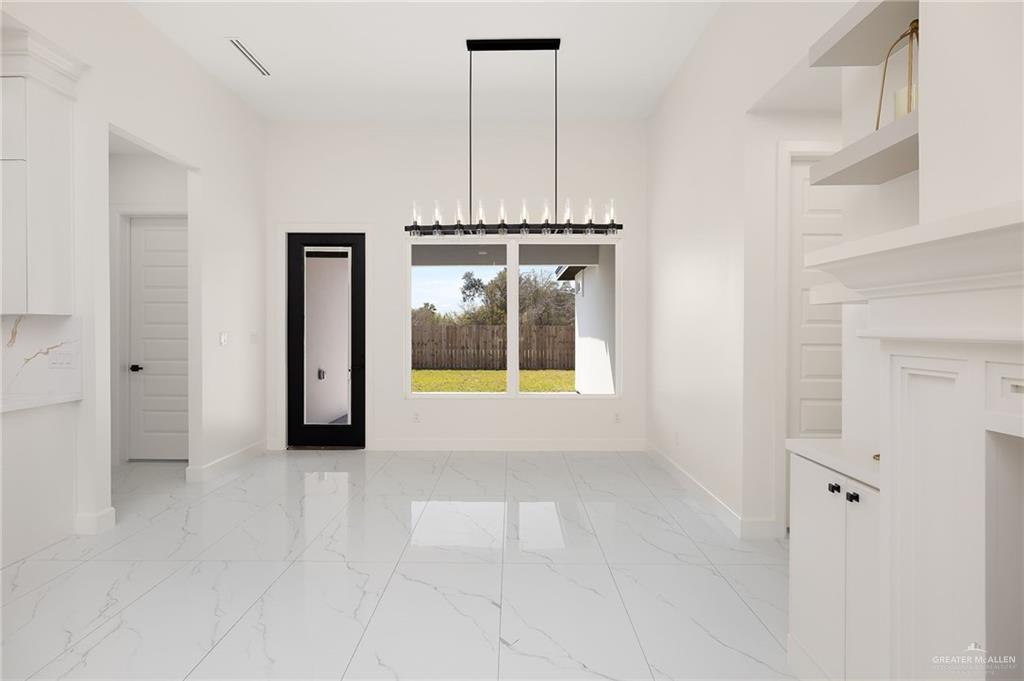 901 Azalea Street Mission, TX 78573 - Photo 12 of 29 Dining area with black light fixtures