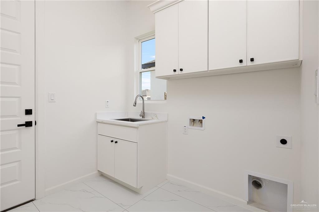 901 Azalea Street Mission, TX 78573 - Photo 14 of 29 Laundry room with cabinet space, washer hookup, and electric dryer hookup