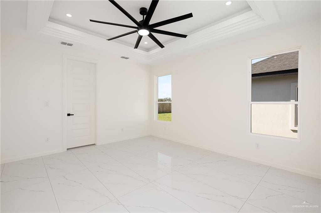 901 Azalea Street Mission, TX 78573 - Photo 15 of 29 Primary Bedroom featuring ceiling fan, and recessed lighting
