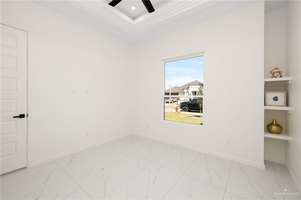 901 Azalea Street Mission, TX 78573 - Photo 18 of 29 Bedroom 1 featuring crown molding, a ceiling fan, recessed lighting