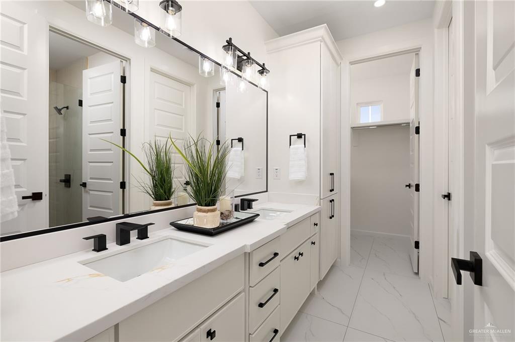 901 Azalea Street Mission, TX 78573 - Photo 19 of 29 Shared Full bathroom with double vanity, and a shower