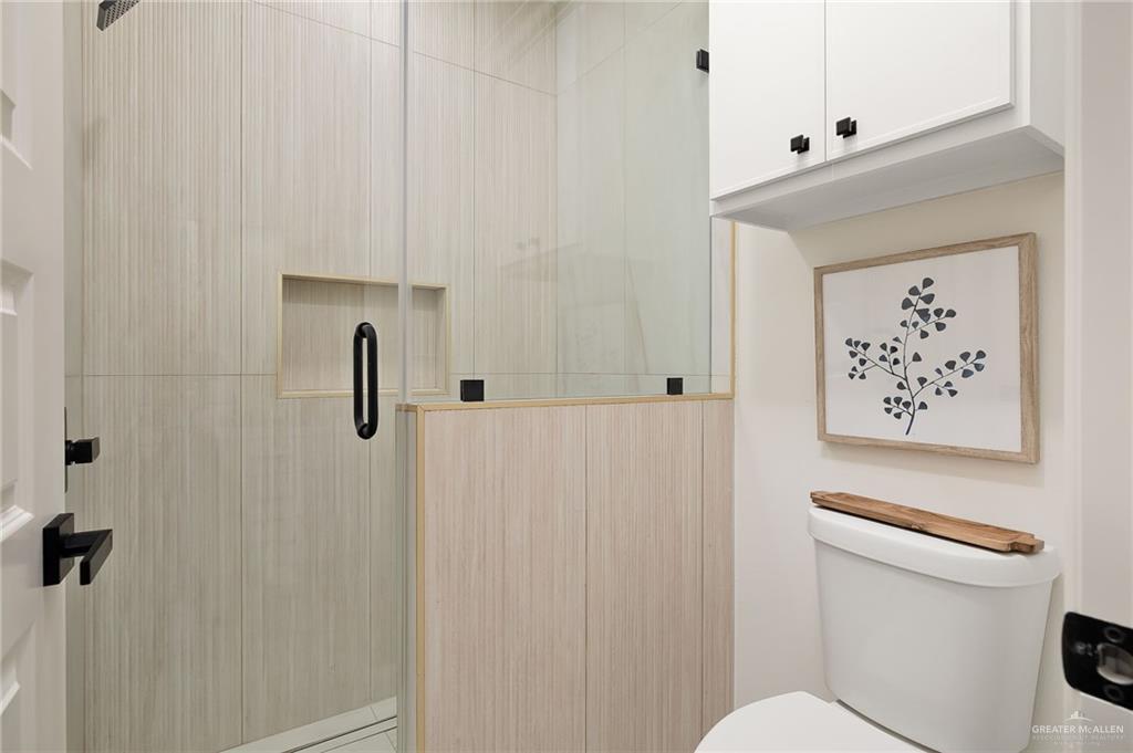 901 Azalea Street Mission, TX 78573 - Photo 20 of 29 Full bath with a shower stall and toilet