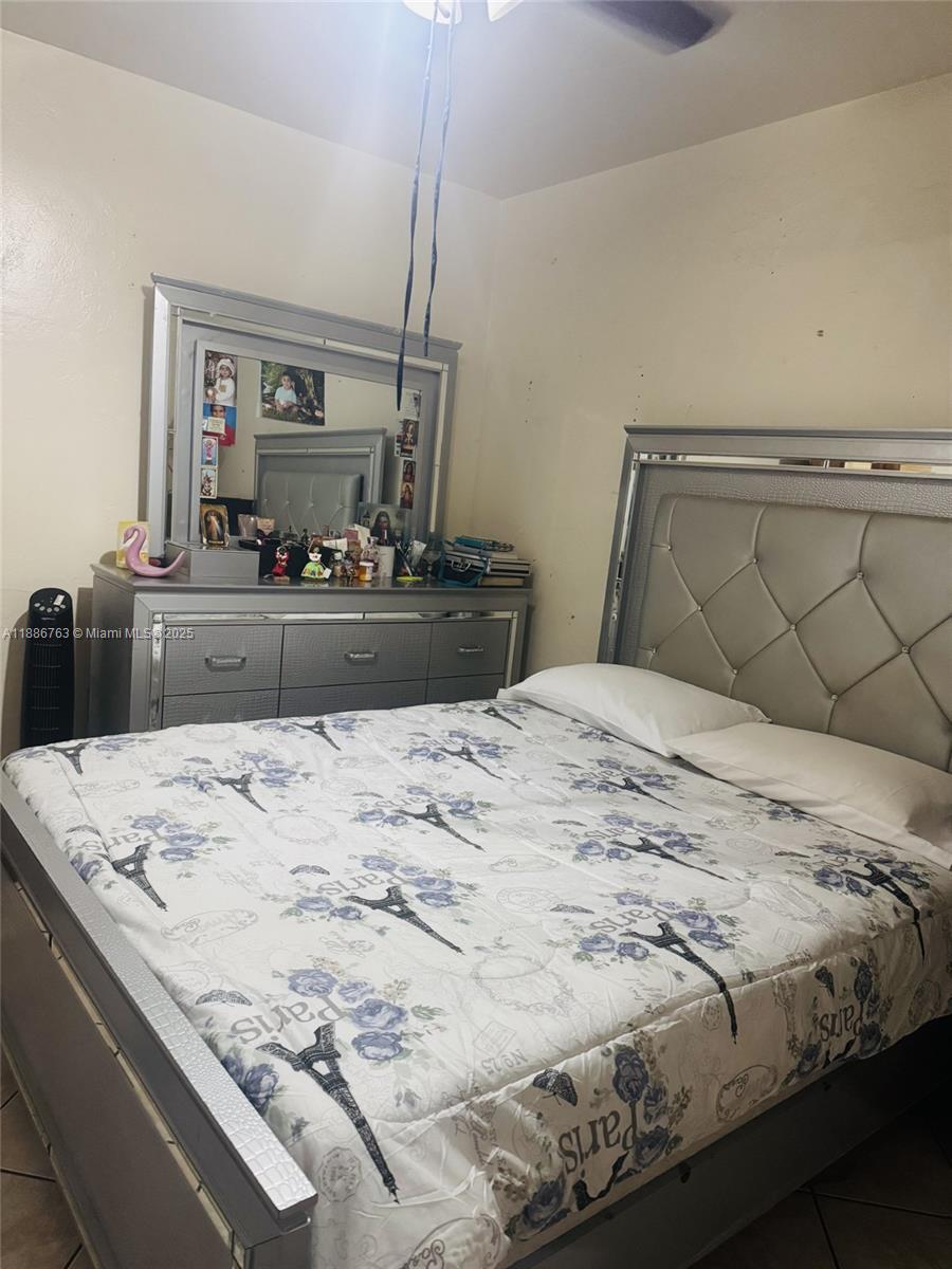 3915 Northwest 4th Terrace Miami, FL 33126 - Photo 16 of 42 a bedroom with a bed and a dresser