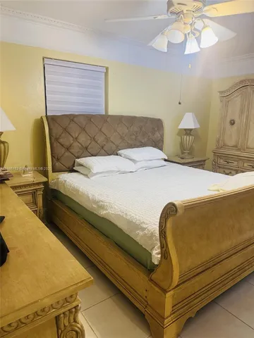 a bedroom with a bed and a walk in closet