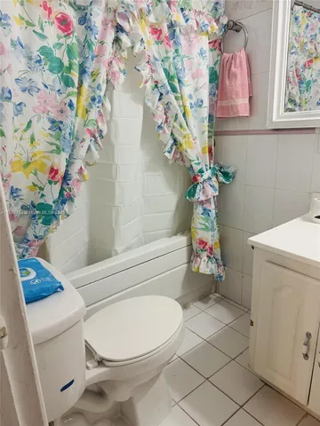 a kitchen with a sink a stove and cabinets
