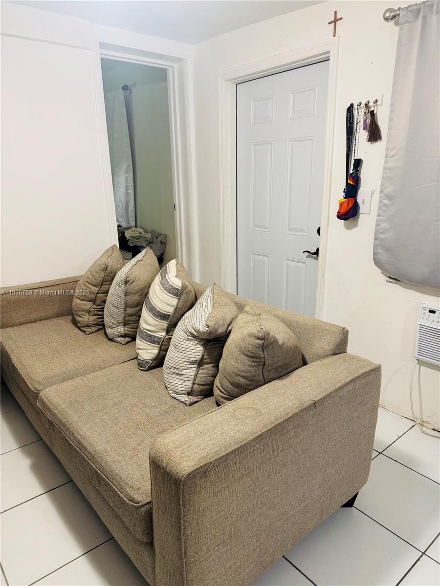 3915 Northwest 4th Terrace Miami, FL 33126 - Photo 34 of 42 a bedroom with a bed and a mirror