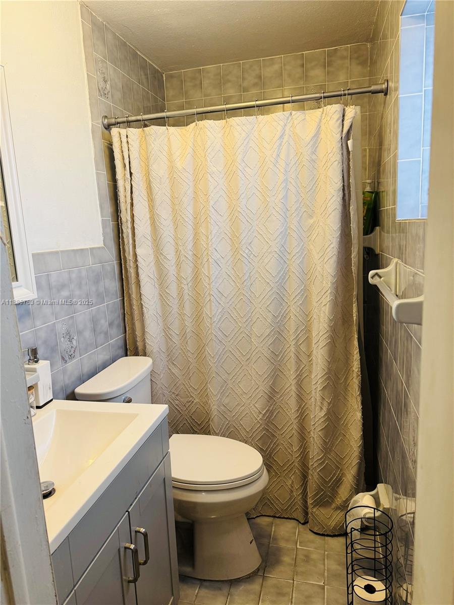 3915 Northwest 4th Terrace Miami, FL 33126 - Photo 39 of 42 a bathroom with a sink and a mirror