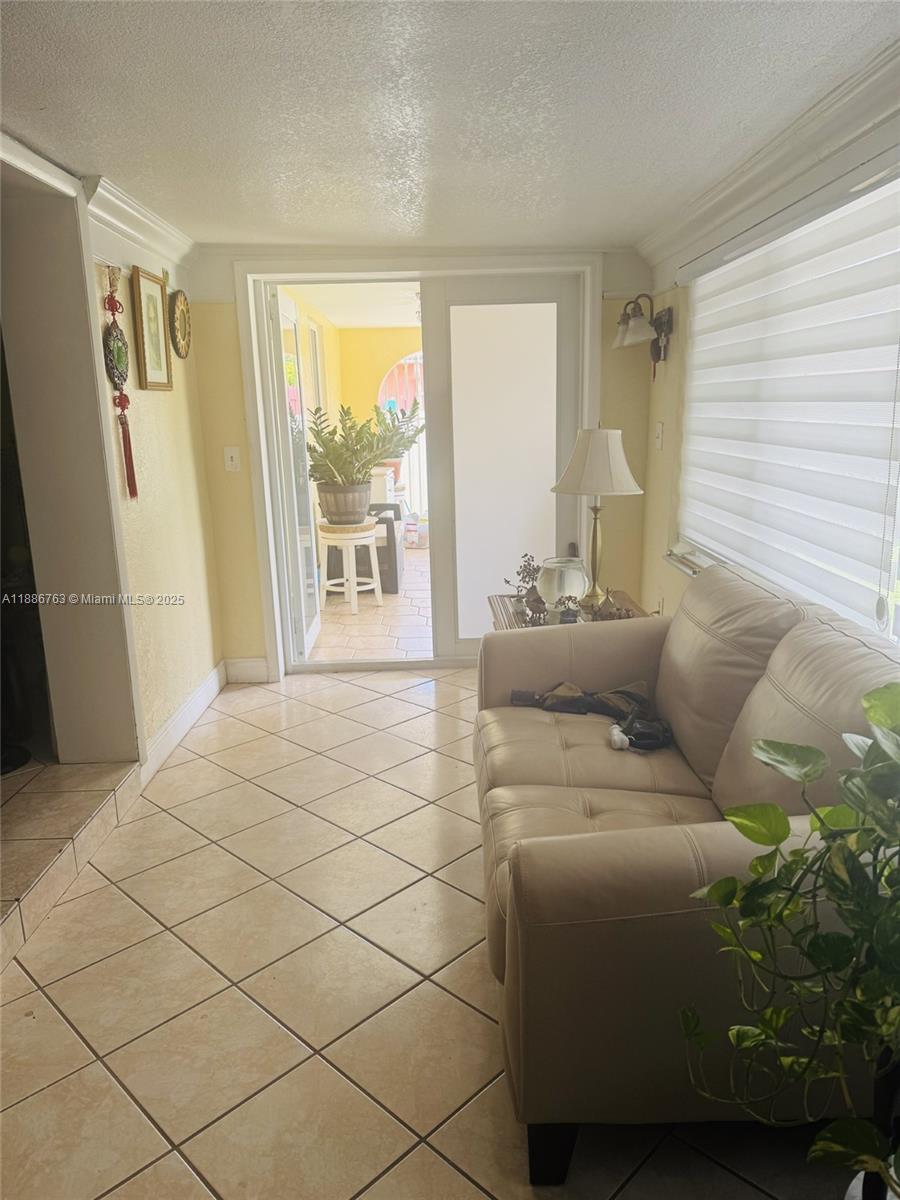 3915 Northwest 4th Terrace Miami, FL 33126 - Photo 5 of 42 a living room with furniture and a window