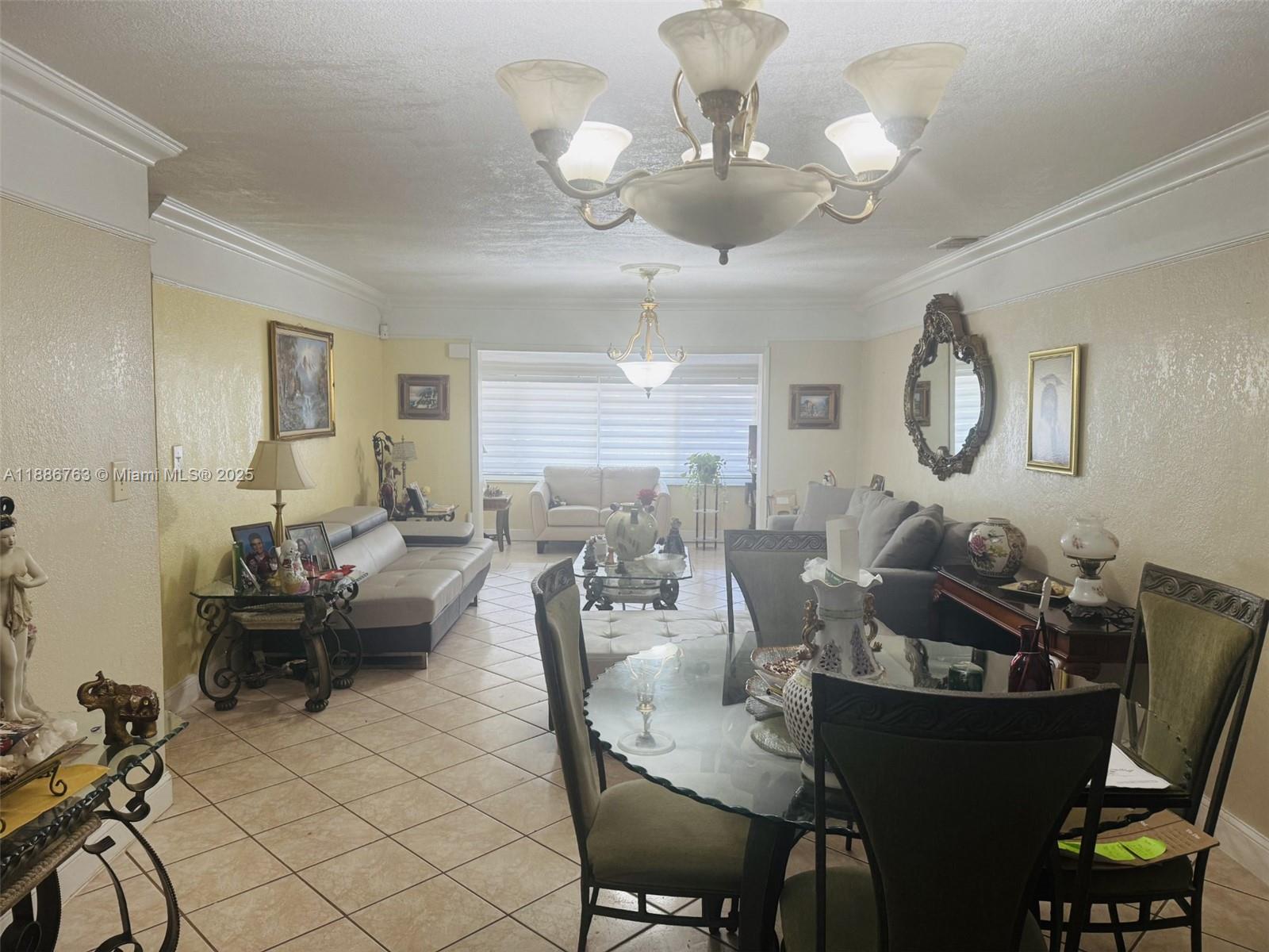 3915 Northwest 4th Terrace Miami, FL 33126 - Photo 7 of 42 a view of a dining room with furniture