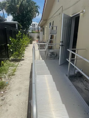 a bedroom with a bed and ceiling fan