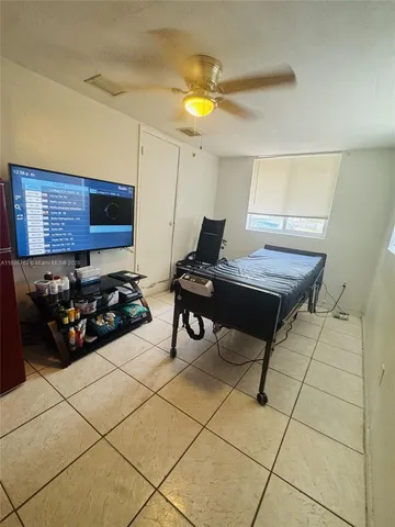 a kitchen with stainless steel appliances granite countertop a refrigerator stove top oven and sink