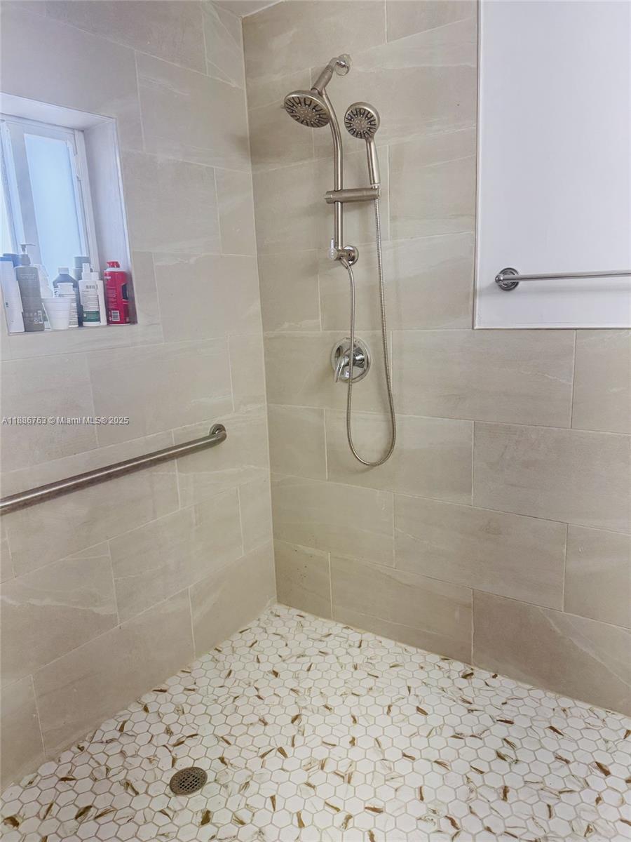 3915 Northwest 4th Terrace Miami, FL 33126 - Photo 10 of 42 a bathroom with a shower