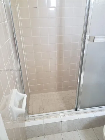 a bathroom with a shower and a bathtub