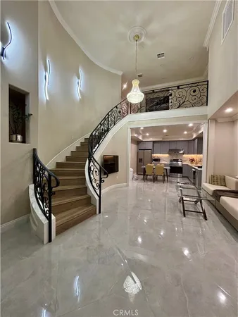 a lobby with furniture and stairs