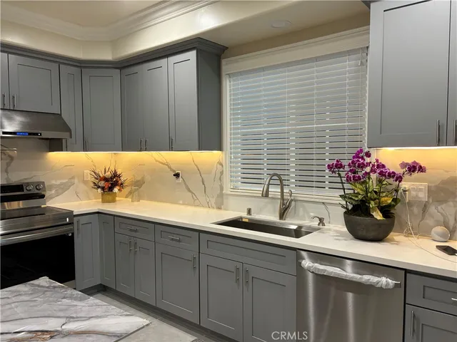 a kitchen with a sink and cabinets