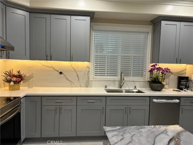 a kitchen with a sink and cabinets