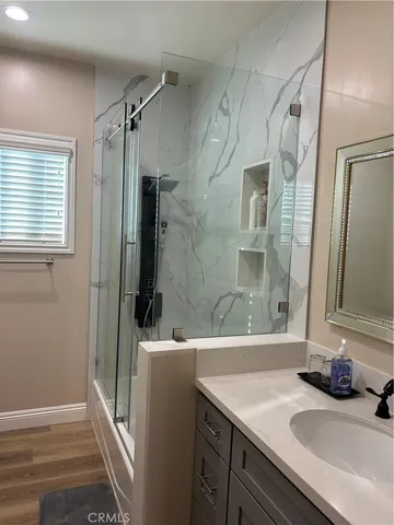 a bathroom with a sink and a mirror