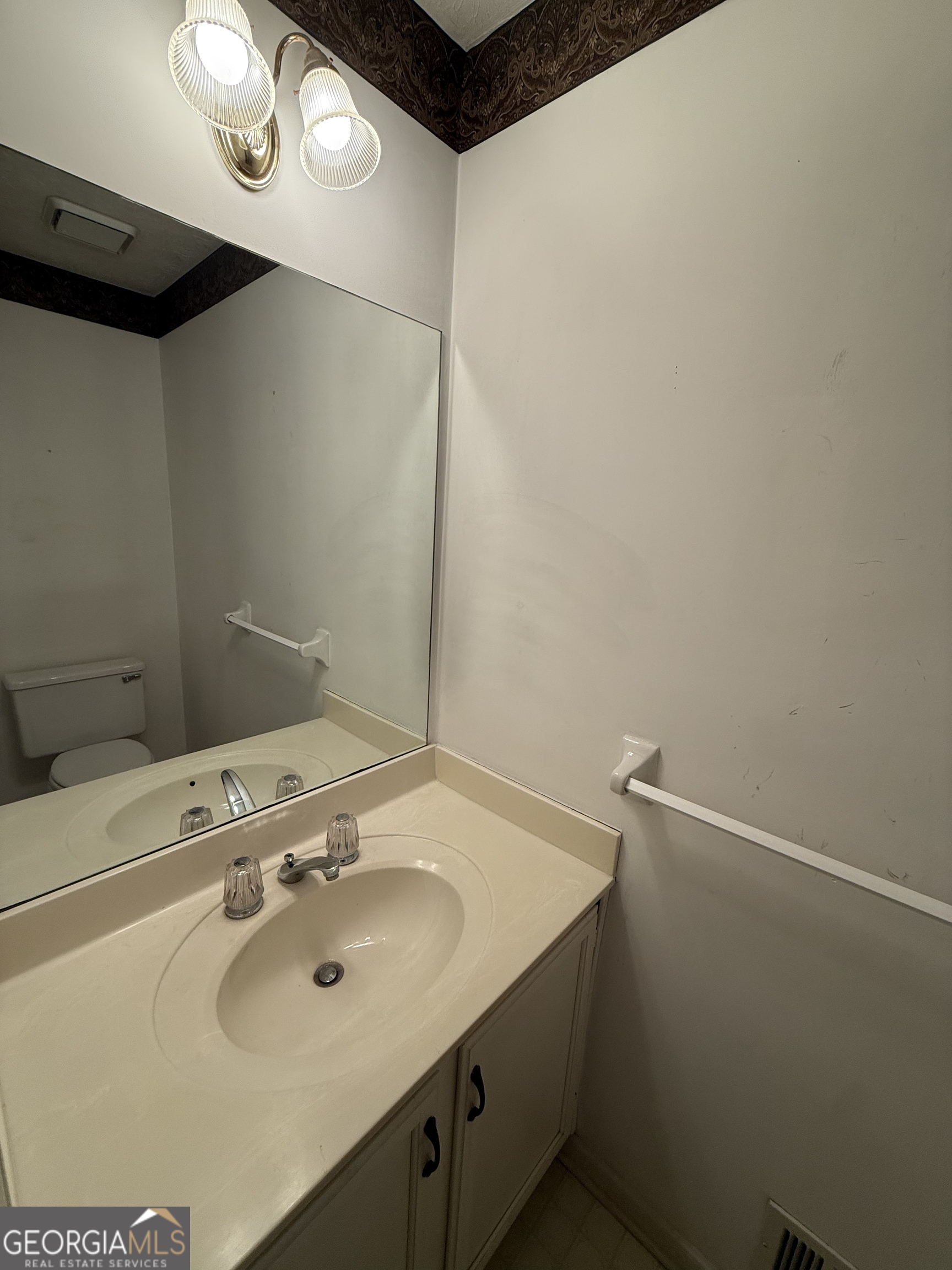 1716 Inlet Cove Court Snellville, GA 30078 - Photo 15 of 17 a bathroom with a sink and a mirror