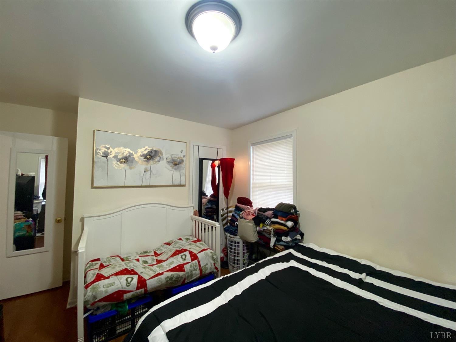 400 Riverside Drive Lynchburg, VA 24503 - Photo 13 of 40 a bedroom with bed and a window