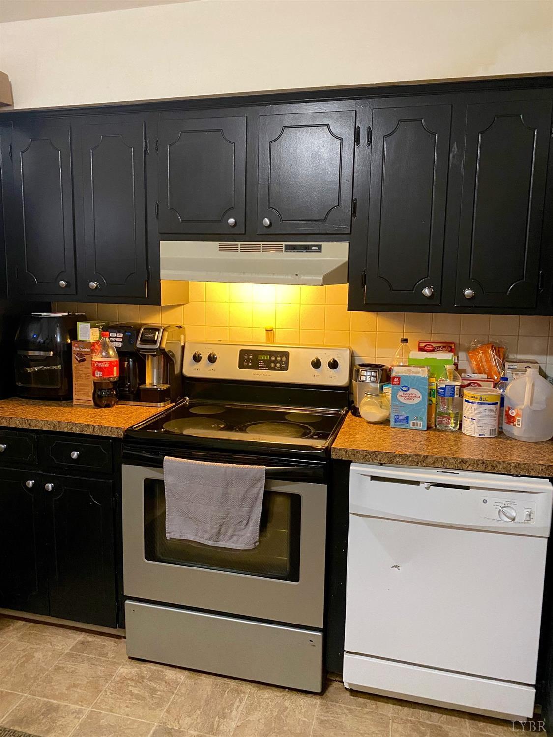400 Riverside Drive Lynchburg, VA 24503 - Photo 15 of 40 a kitchen with granite countertop wooden cabinets and stainless steel appliances