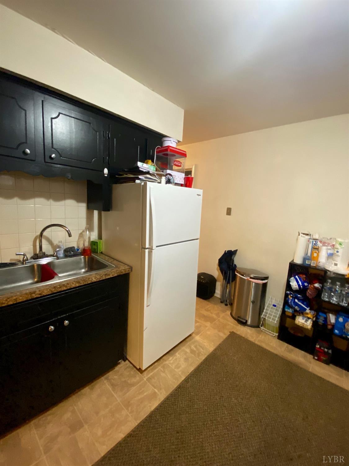 400 Riverside Drive Lynchburg, VA 24503 - Photo 18 of 40 a kitchen with a refrigerator and a sink