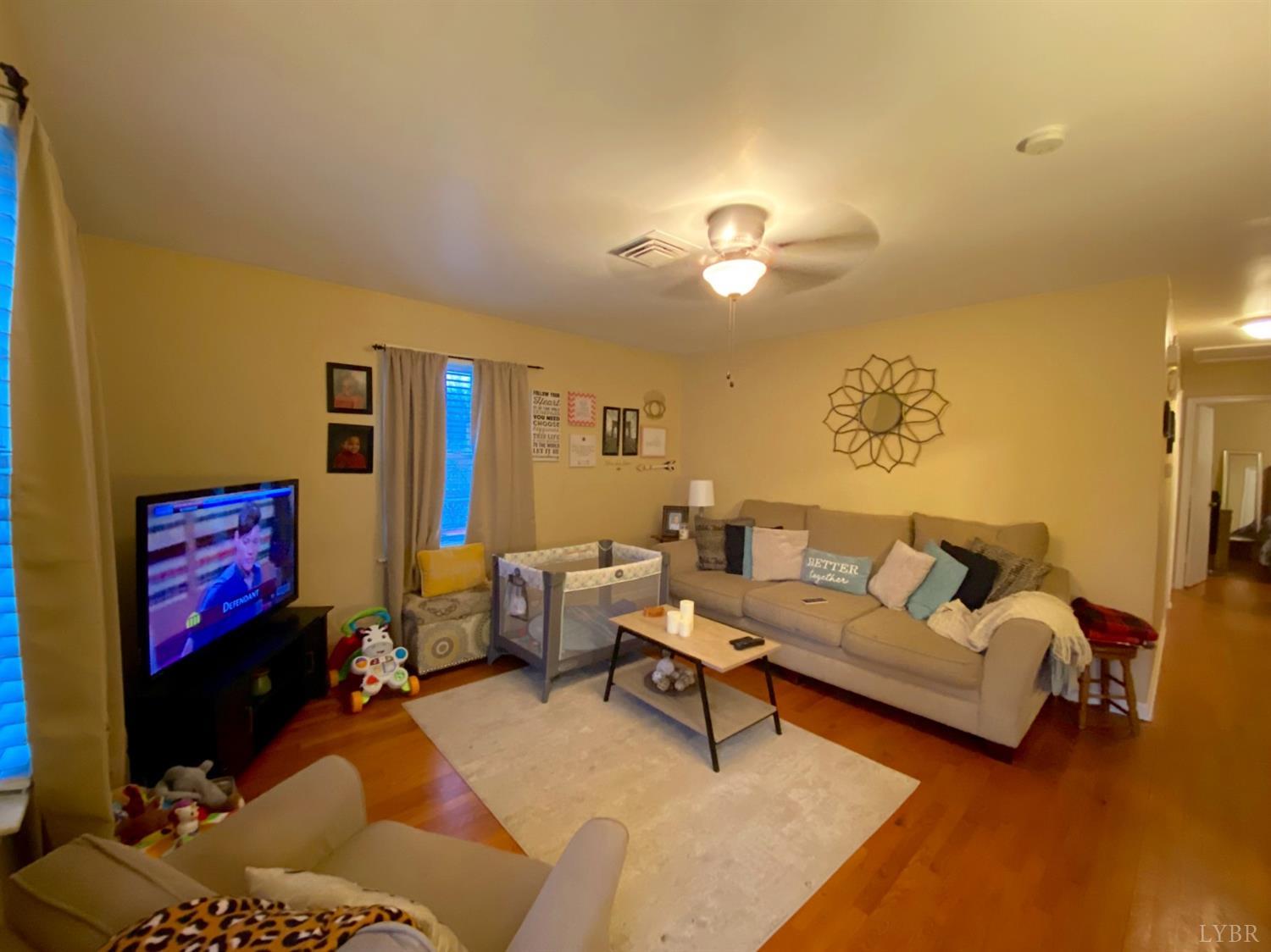 400 Riverside Drive Lynchburg, VA 24503 - Photo 21 of 40 a living room with furniture and a flat screen tv