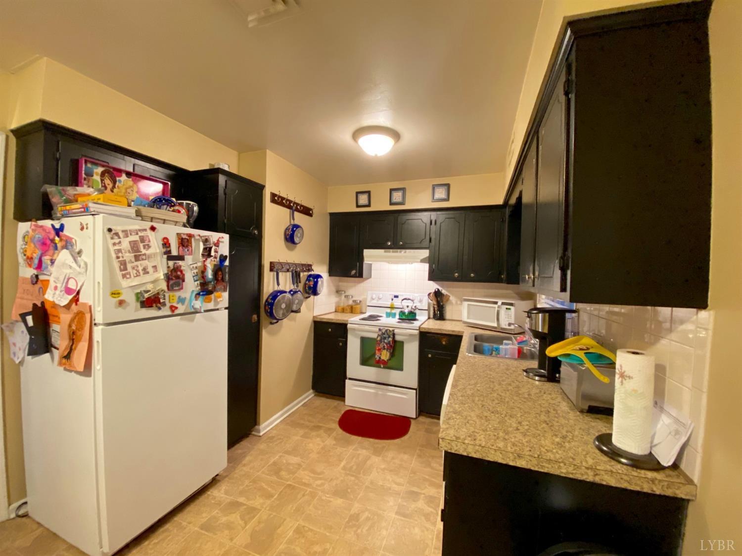 400 Riverside Drive Lynchburg, VA 24503 - Photo 26 of 40 a kitchen with a refrigerator sink and stove