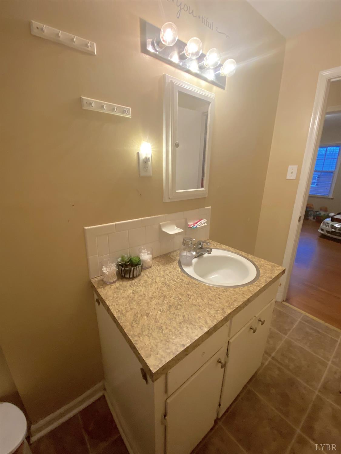 400 Riverside Drive Lynchburg, VA 24503 - Photo 29 of 40 a bathroom with a sink toilet and a mirror