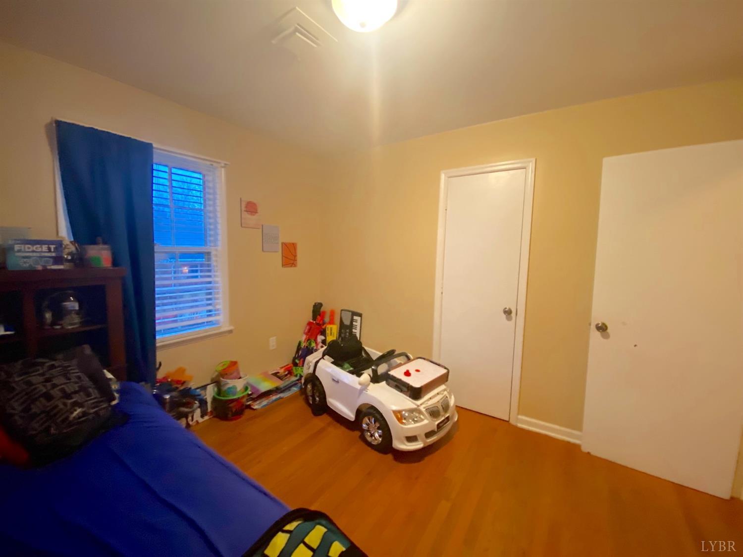 400 Riverside Drive Lynchburg, VA 24503 - Photo 30 of 40 a room with furniture and wooden floor