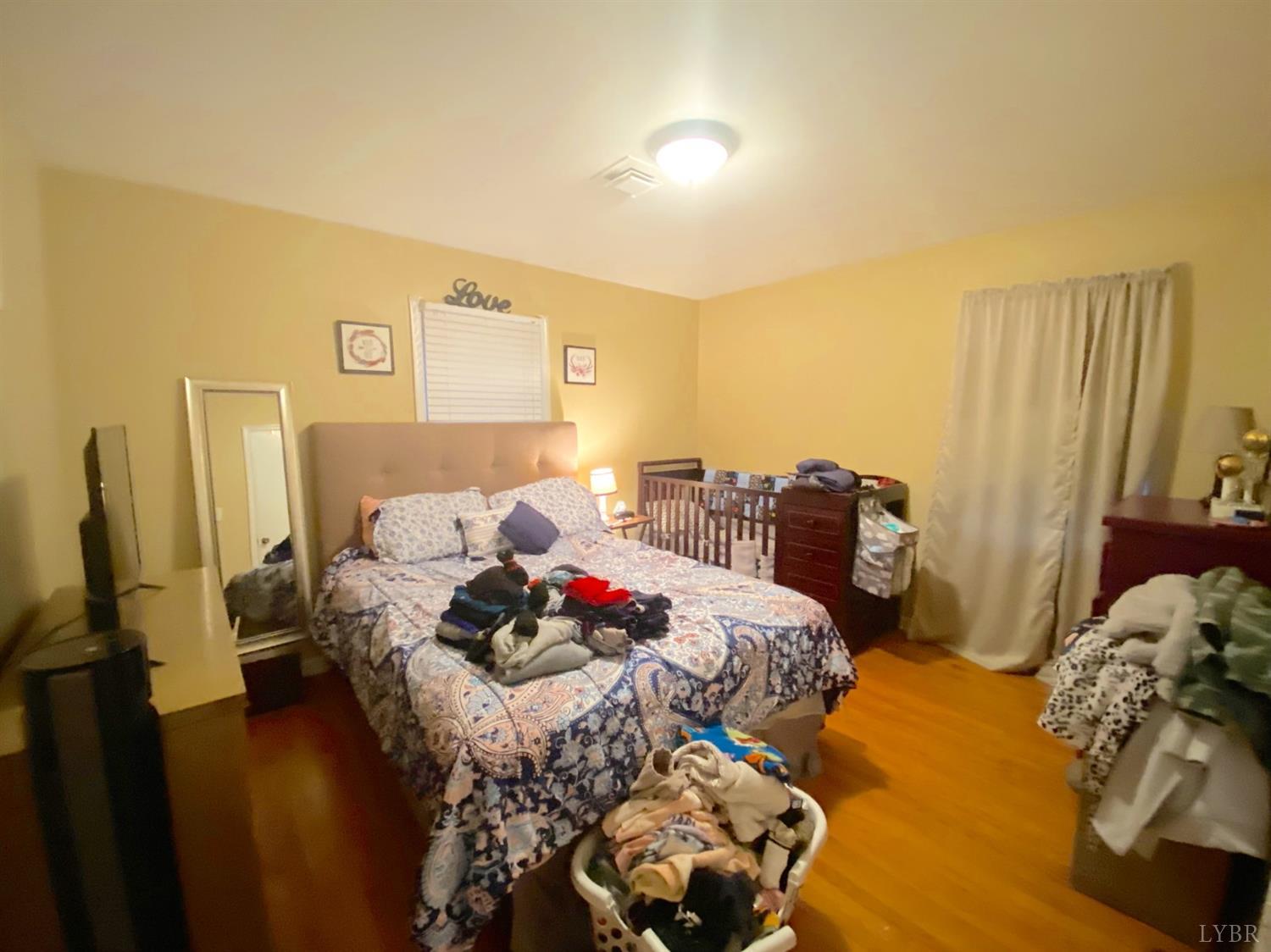 400 Riverside Drive Lynchburg, VA 24503 - Photo 34 of 40 a bedroom with a bed and a couch