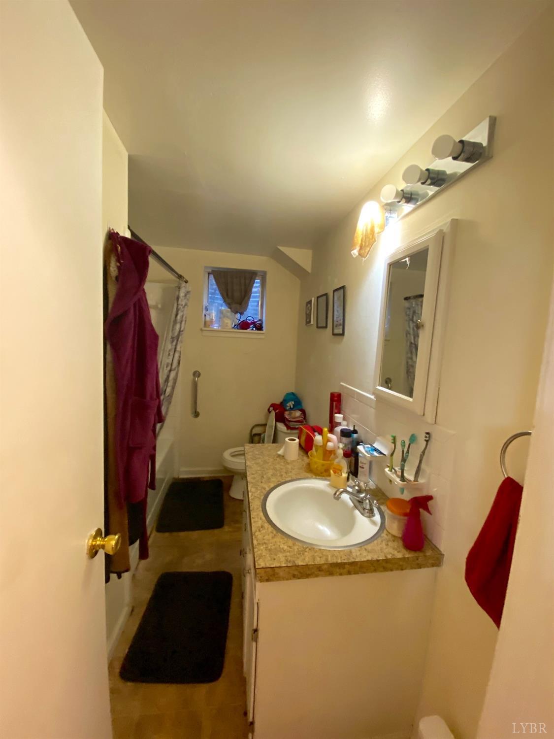 400 Riverside Drive Lynchburg, VA 24503 - Photo 10 of 40 a bathroom with a sink and a mirror