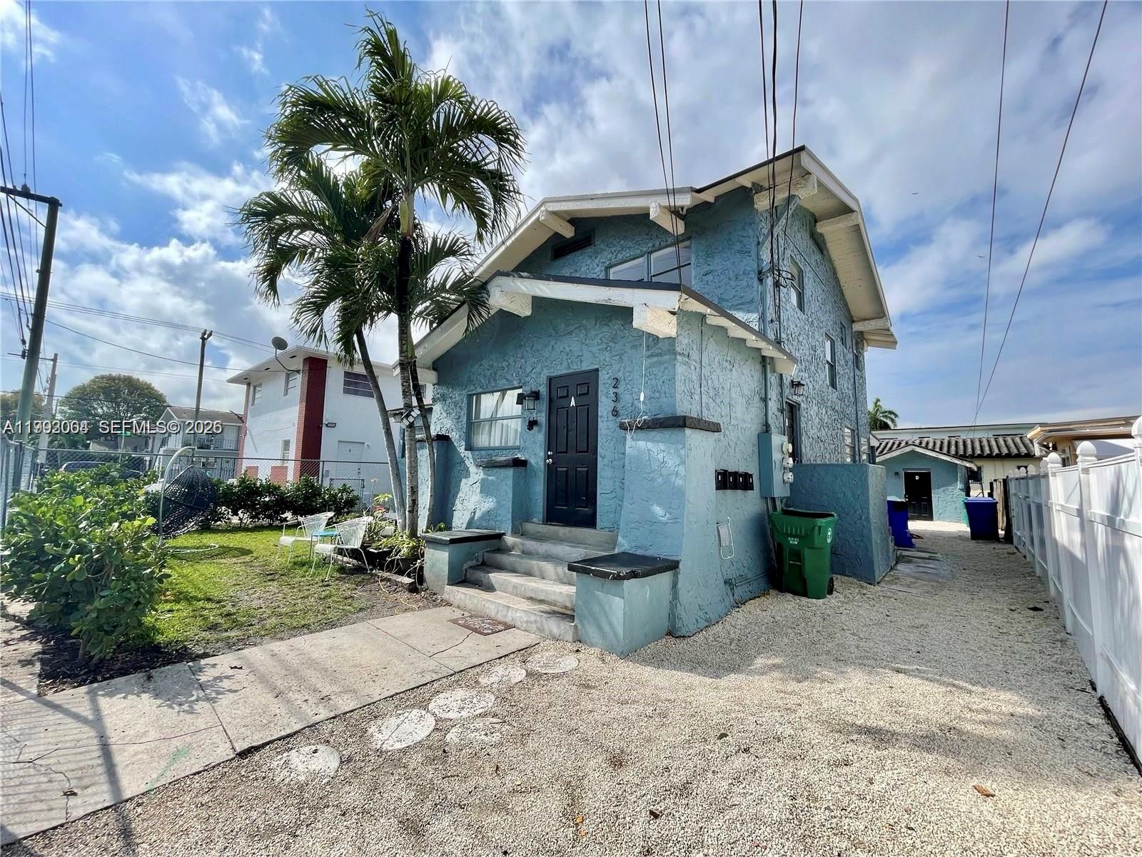 a view of a house with a small yard
