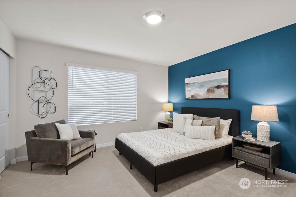 23413 Edmonds Way, Unit E2 Edmonds, WA 98026 - Photo 12 of 22 a bedroom with a bed and window