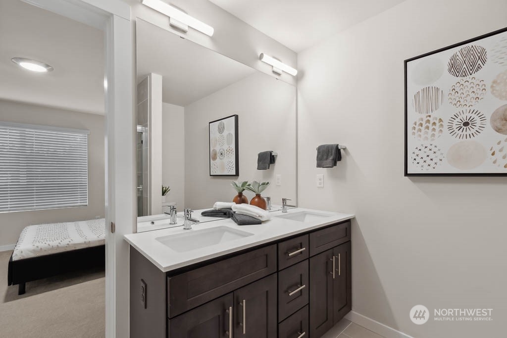 23413 Edmonds Way, Unit E2 Edmonds, WA 98026 - Photo 15 of 22 a bathroom with a sink and a mirror