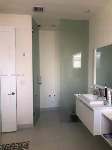 a bathroom with a sink a toilet and vanity