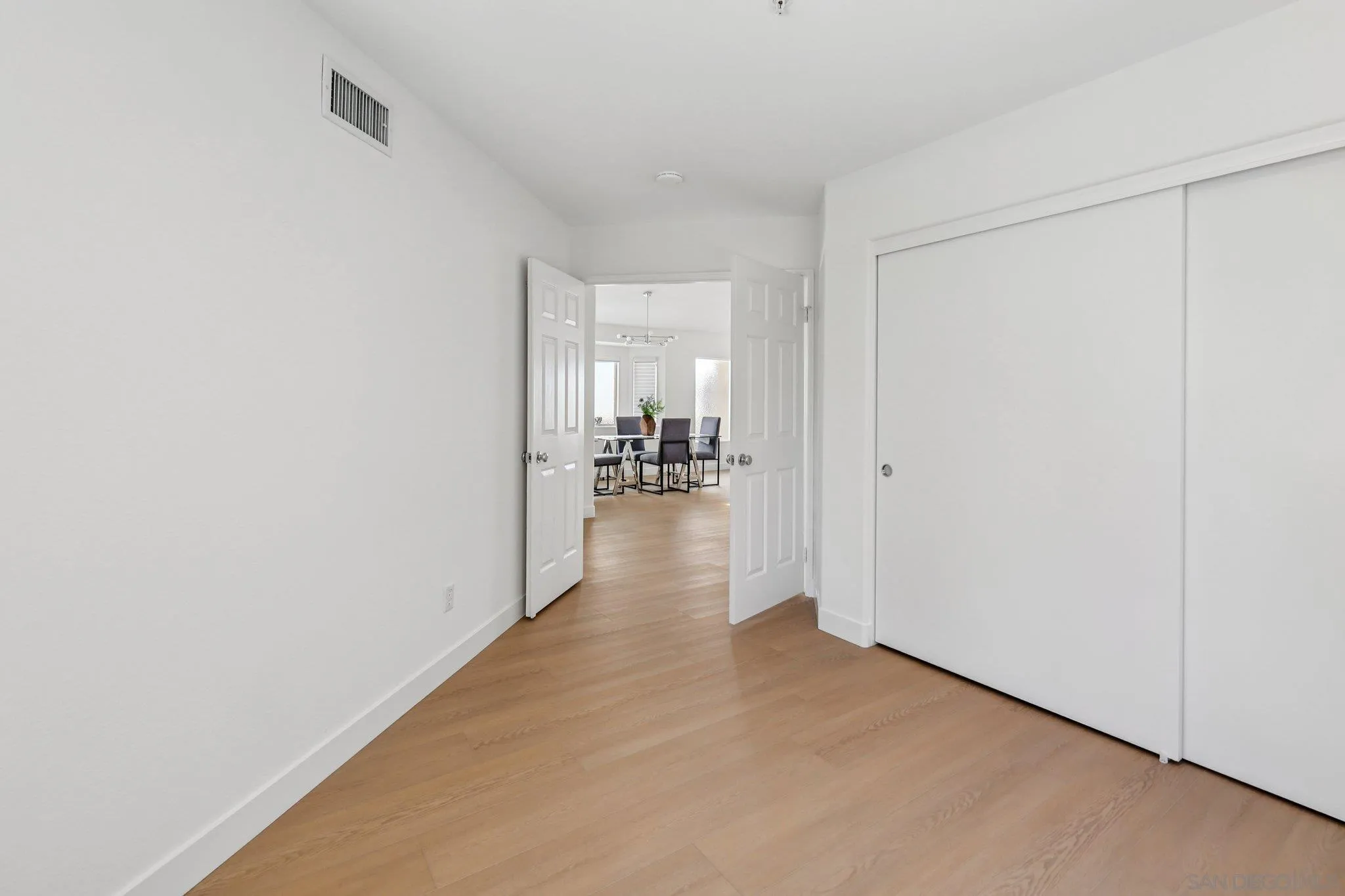 2491 Moonlight Glen Escondido, CA 92026 - Photo 34 of 58 a view of a hallway with wooden floor
