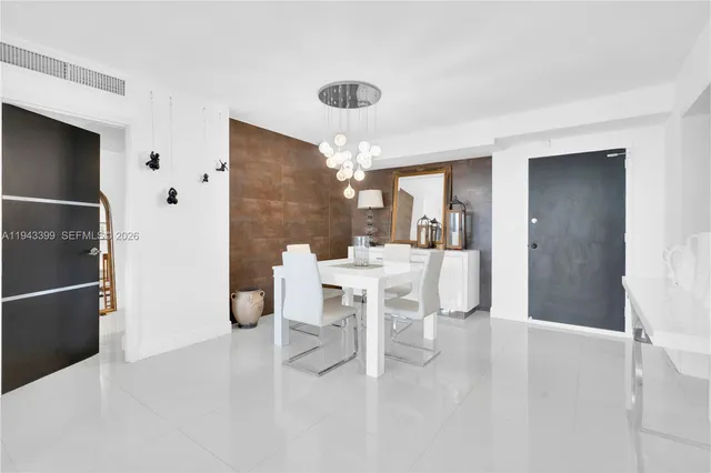 a living room with furniture and white walls