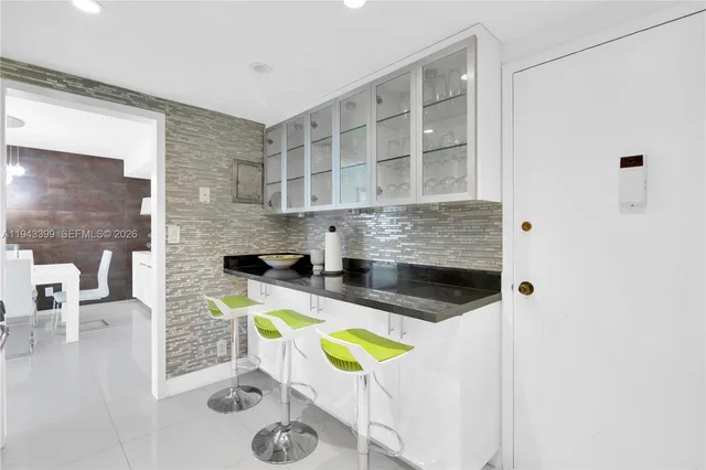 a kitchen with stainless steel appliances granite countertop a stove a refrigerator and a stove