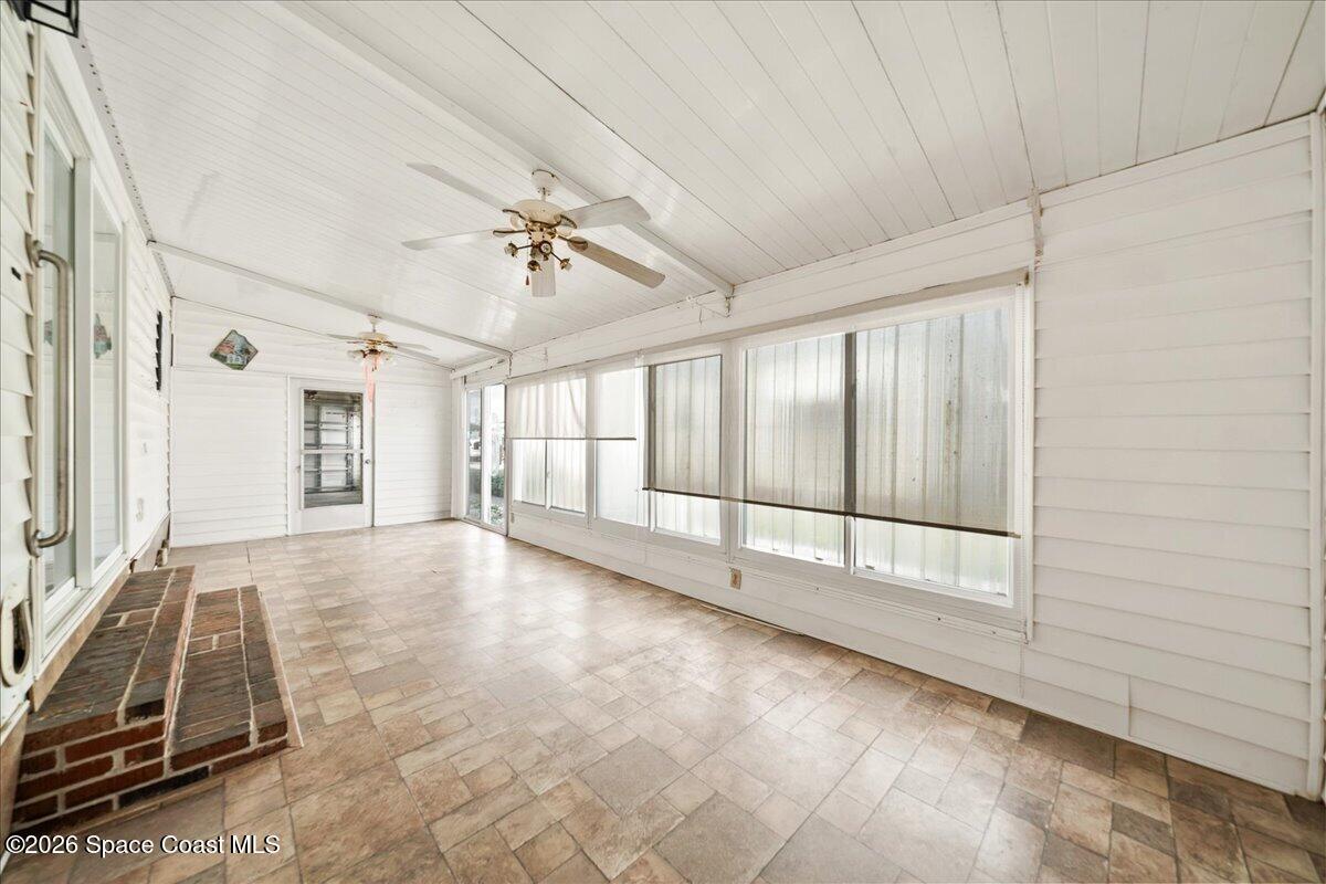 1813 Coco Plum Street Northeast Palm Bay, FL 32905 - Photo 19 of 44 a view of an empty room with a window