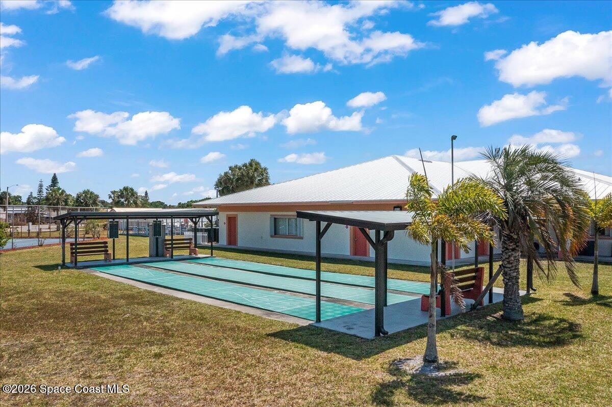 1813 Coco Plum Street Northeast Palm Bay, FL 32905 - Photo 30 of 44 a view of a house with a yard
