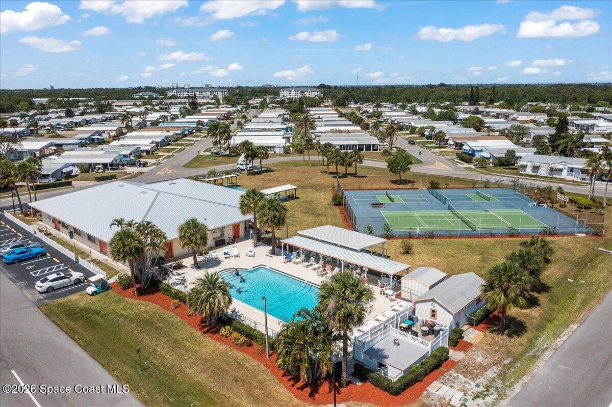 1813 Coco Plum Street Northeast Palm Bay, FL 32905 - Photo 33 of 44 an aerial view of a building with outdoor space