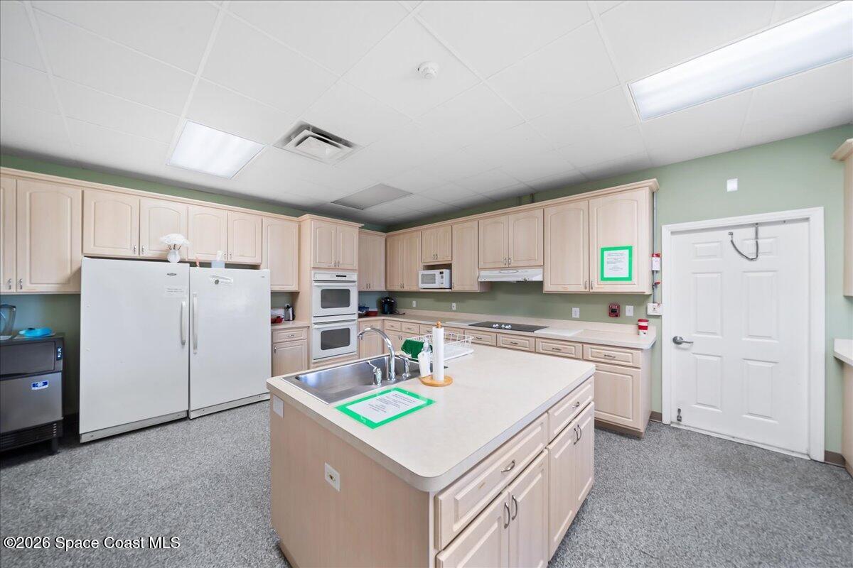 1813 Coco Plum Street Northeast Palm Bay, FL 32905 - Photo 39 of 44 a kitchen that has a cabinets and a stove