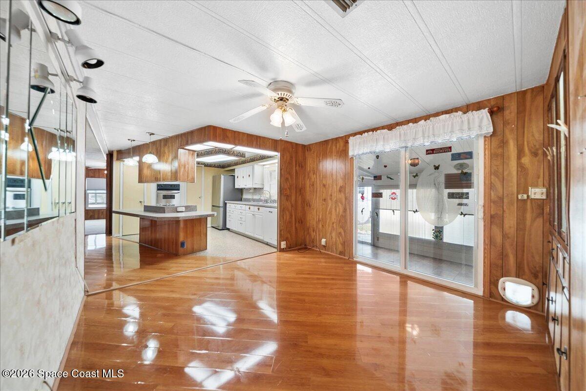 1813 Coco Plum Street Northeast Palm Bay, FL 32905 - Photo 9 of 44 a view of a kitchen with refrigerator and cabinets